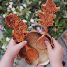 Load image into Gallery viewer, A wooden spoon with delicate flower carvings on the handle, designed for nature-themed play and adding beauty to every mix