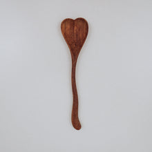 Load image into Gallery viewer, A large wooden spoon carved into a heart shape, perfect for mixing outdoor concoctions and adding a bit of charm to imaginative play. Tuckered Out
