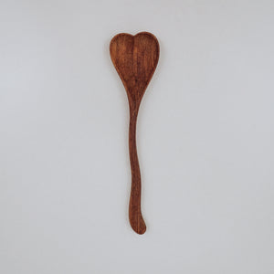 A large wooden spoon carved into a heart shape, perfect for mixing outdoor concoctions and adding a bit of charm to imaginative play. Tuckered Out