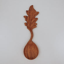 Load image into Gallery viewer, A handcrafted wooden spoon featuring a carved leaf cutout on the handle, ideal for bringing a forest-inspired feel to children’s outdoor play.
