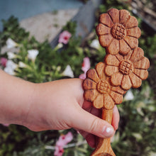 Load image into Gallery viewer, A wooden spoon with delicate flower carvings on the handle, designed for nature-themed play and adding beauty to every mix
