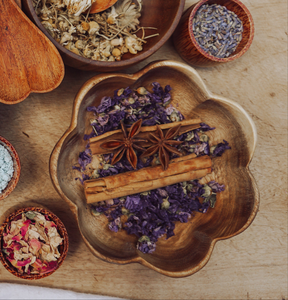 A larger wooden bowl carved in the shape of a flower, ideal for mixing potions or gathering natural treasures during outdoor play.
